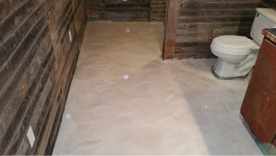 Metallic epoxy floor in a bathroom of a commerce of Gastonia,NC. Job done by Epoxy Floor Gastonia Pros.